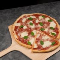 Margherita · Pizza sauce, basil, fresh mozzarella and parmigiano
