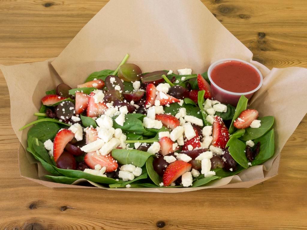 Strawberry Spinach Salad · Baby spinach, cranberries, strawberries, red grapes and feta cheese served with raspberry vinaigrette.