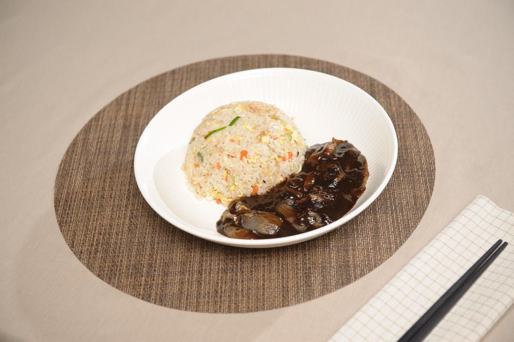 Jjajang Fried Rice · Egg fried rice and vegetables topped with jjajang sauce.