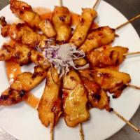 Satay · Beef or chicken marinated with Thai herbs, skewered and grilled served with peanut sauce and...