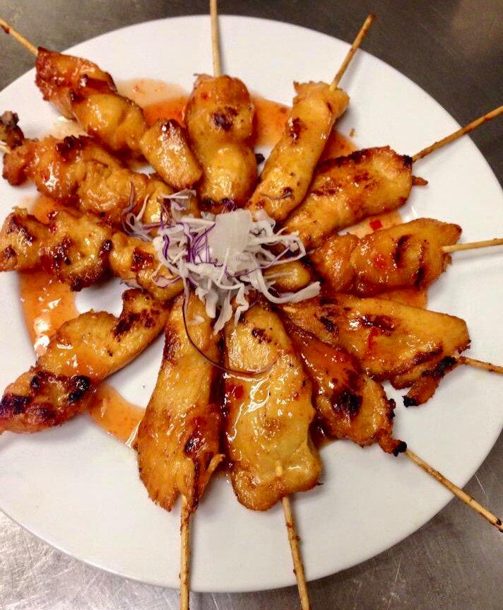Satay · Beef or chicken marinated with Thai herbs, skewered and grilled served with peanut sauce and sweet chili sauce(4).