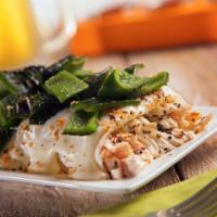 Chicken Poblano Burrito · Seasoned chicken and cheese, topped with fire roasted poblano peppers and a rich and creamy ...