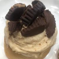 Peanut butter cup  · Peanut butter frosting topped with our handmade peanut butter cups and chocolate drizzle