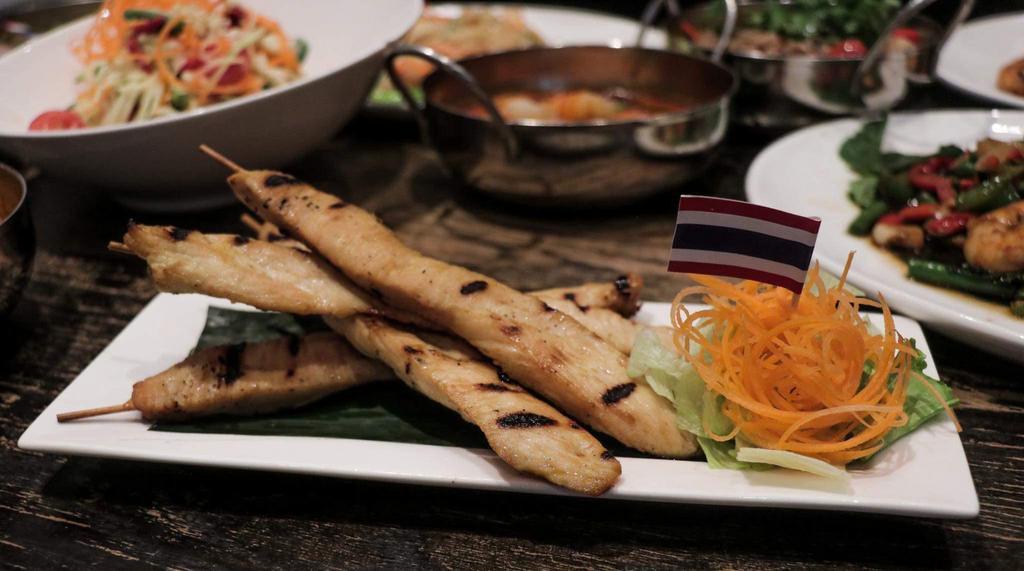 Chicken Satay  · 4 skewers. Grilled marinated chicken on skewers. Served with peanut sauce and cucumber sauce.