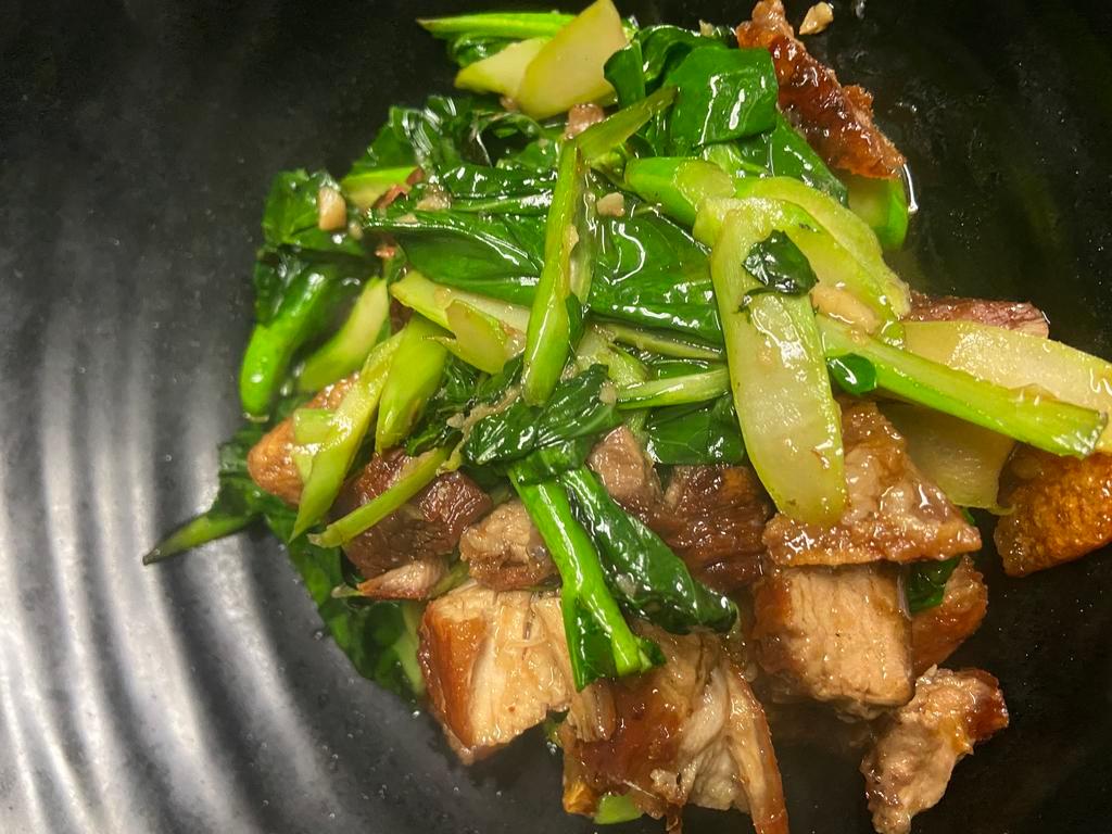 Crispy Pork Kana  · Crispy pork belly stir-fried with brown sauce and Chinese broccoli.