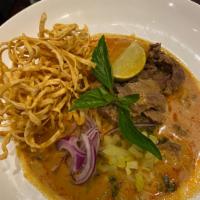 Kao Soi Beef  · Northern style special curry served with egg noodle, red onions, pickled mustard, fried shal...