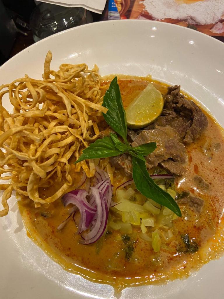 Kao Soi Beef  · Northern style special curry served with egg noodle, red onions, pickled mustard, fried shallots and topped with crispy noodles.