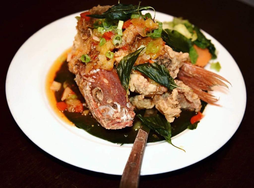 Sweet Chilli Red Snapper · Fried whole red snapper served with steamed vegetables
topped with sweet chilli sauce. 
