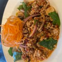 Chicken Larb  · Thai eastern style salad with ground chicken, red onions,scallions, mint leaves and chili li...