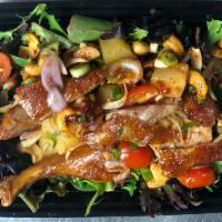 Duck Salad · Crispy roasted duck, onion, tomato, pineapple, cashew nut, roasted chili and lime dressing s...