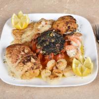 Broiled Seafood Combo · Stuffed filet of sole, stuffed clams, scrod, broiled shrimp, scallops and stuffed tomato wit...