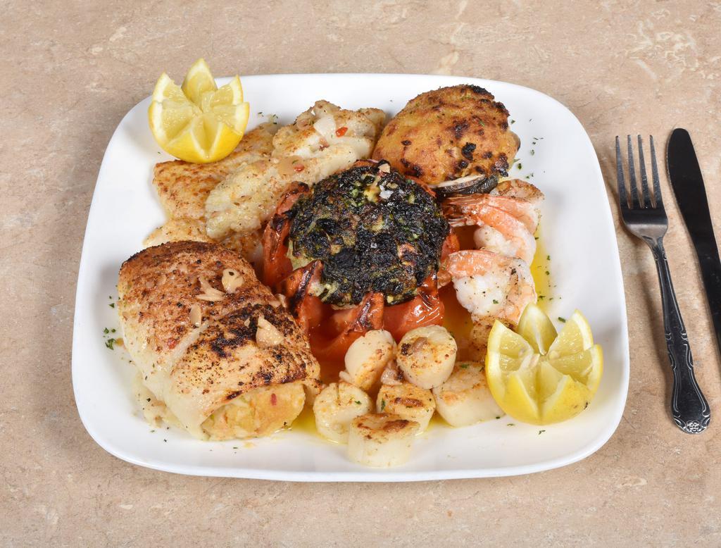 Broiled Seafood Combo · Stuffed filet of sole, stuffed clams, scrod, broiled shrimp, scallops and stuffed tomato with spinach and feta cheese.