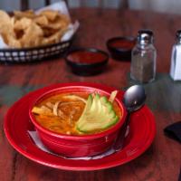 Chicken Tortilla Soup · Topped with tortilla strips and avocado. All chilies served with warm flour tortillas.