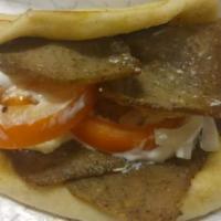 Gyros Sandwich · Cooked on a spit and wrapped in a pita. Dressed with sour cream, onions and tomatoes. 