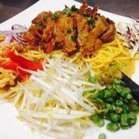 Chiang Mai Noodles · Traditional noodle of Northern Thailand. Chicken and shrimp sauteed with yellow noodles and ...
