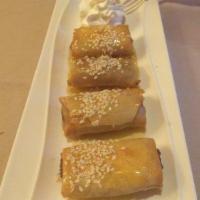 Fried Banana with Honey · Served with honey and sesame seeds.