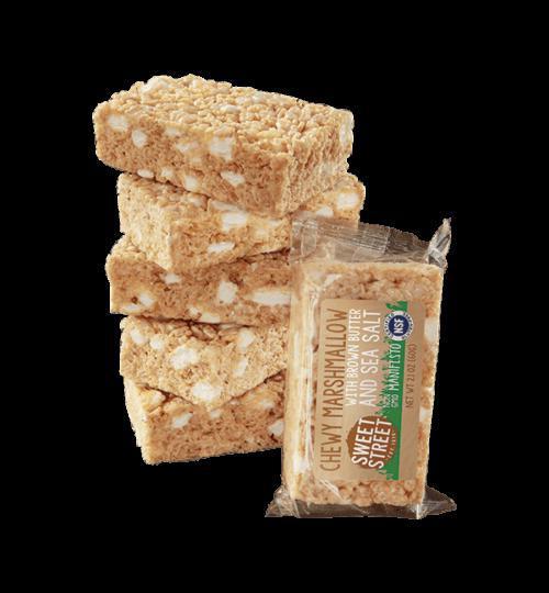 Chewy Marshmallow Bar (GF) · Americans have been enjoying the gooey crispiness of these treats since the early 1900’s. This version is, shall we say…more sophisticated and every bit as fun! Marshmallow cream and mini-marshmallows – both homemade, all natural and GMO-free – get folded with gluten-free crispy rice puffs and a touch of browned butter for a subtle caramel note. A hint of sea salt makes it all come alive.