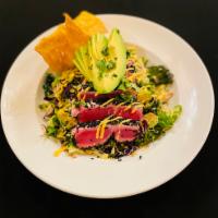 Ahi Tuna Salad · cabbage and kale mix tossed with jalapeno sesame vinaigrette topped with pan-seared Ahi tuna...