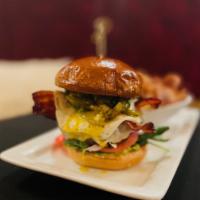 Green Chili Burger · USDA beef, calabrese aioli, lettuce, tomato, red onion, muenster cheese, green chili, jalape...
