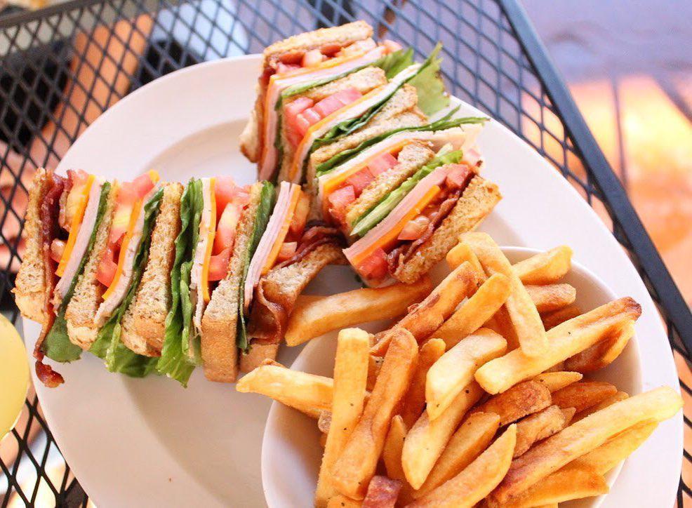 Club Sandwich · Ham, turkey, bacon, mayo, lettuce, tomato, cheddar and Swiss on wheat bread.