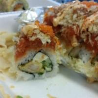 Flaming Amy Roll · In: shrimp tempura, cream cheese, cucumber and jalapeno. Out: spicy tuna, tempura crumb, tob...
