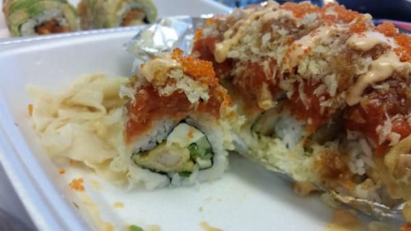 Flaming Amy Roll · In: shrimp tempura, cream cheese, cucumber and jalapeno. Out: spicy tuna, tempura crumb, tobiko and sweet spicy sauce. Spicy.
