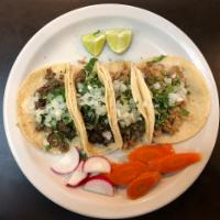 Traditional Taco. Any item with lengua, tripa or barbacoa will be estra charge of 0.30 cents · Corn tortillas, your choice of meat, hot salsa, garnished with onions and cilantro.
