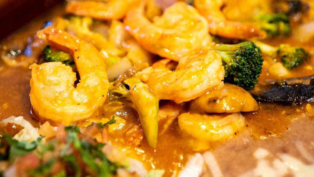 Camarones a la Diabla · Prawns, onions, broccoli, mushrooms, sauteed in our house spicy sauce, ask for habanero salsa. Served with rice and beans and homemade tortillas!