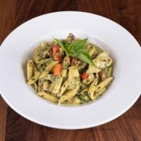Chicken Pesto Pasta · Al dente penne pasta with grilled chicken, Roma tomatoes and artichoke hearts and tossed in ...