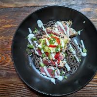 Sesame Seared Ahi Tuna · Soba Noodles, Green Onions, Pickled Fresno Chiles, Asian Cucumber Salad, Miso Wasabi Dressing.
