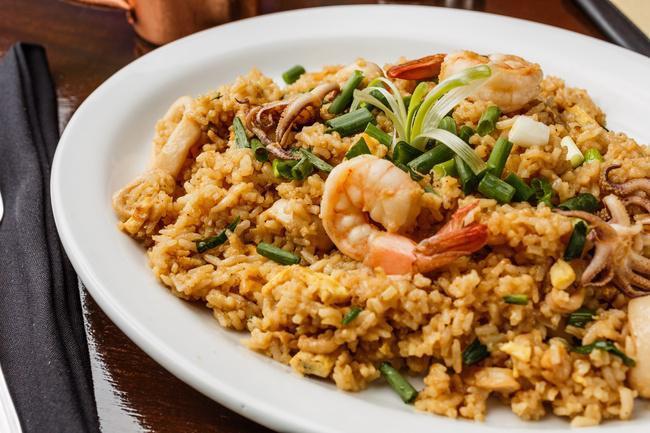 Chaufa de Mariscos · Chinese inspired Peruvian style seafood fried rice mixed with scrambled eggs, green onions and soy sauce.