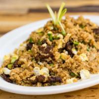 Chaufa de Carne · Chinese inspired Peruvian style Certified Angus Beef fried rice mixed with scrambled eggs, g...