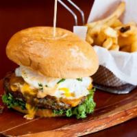 El Mono Burger · Homemade Certified Angus Beef patty with cheddar, sweet fried plantains, fried egg, and Aji ...