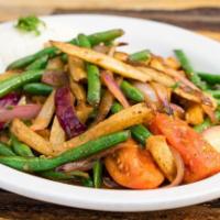 Saltado de Vainitas · Stir fried green beans, onions, tomatoes, fried potatoes, cilantro and soy sauce, served wit...