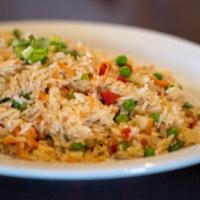 Veggie Chaufa · Peruvian style veggie fried rice mixed with scrambled eggs, green onions and soy sauce.