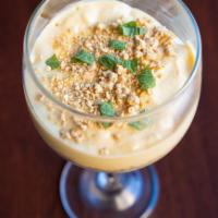 Passion Fruit Mousse · Passion fruit mousse served with cookie crumbles.