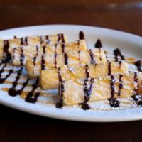 Sweet Yuca Fries · Cassava fries served with caramel and confectioners sugar.