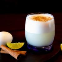Pisco Sour · Pisco, fresh lime juice, pasteurized egg whites, syrup, cinnamon, and bitters.