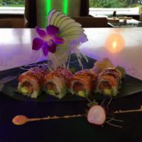Dancing Eel Roll · Shrimp tempura and mango inside with eel and avocado on top.