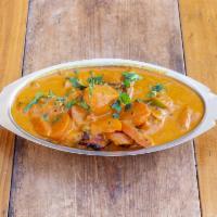 Madras Chicken Curry · A hearty bowl of boneless chicken, carrots, potatoes, & peas cooked in Madras curry spices a...