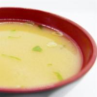 Miso Soup  · Tofu, green onion, and seaweed in soybean broth.