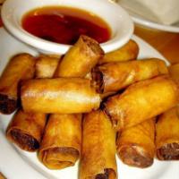Philipino Lumpia (6) · Fried tiny rolls filled with a delectable blend of pork and vegetables served with sweet and...