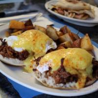 Irish Benedict · Crispy grilled corned beef hash and 2 poached eggs on oversize English muffins smoothered in...