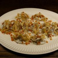 Mantu · Dumplings stuffed with ground beef, onions and spices.