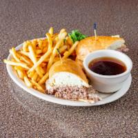 The Double Wheel Chuck Wagon · 2 grilled beef patties with Swiss cheese on a French roll. Served with au jus dip.