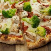Cacciatore Pizza · Roasted chicken, broccoli, sun dried tomatoes, tomatoes, tomato sauce and mozzarella cheese.
