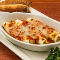 Manicotti · 3 pasta shell rolls with 3 cheese mix. Topped with tomato sauce and mozzarella cheese.