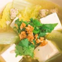 Tom Jued Soup · Clear broth soup with chicken, silver noodles, tofu, Napa cabbage, onion. Topped with green ...