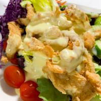 Salad Gai · Marinated double cooked crispy chicken placed on mixed greens with homemade lemon creamy dre...