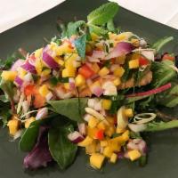 Healthy Salmon · Grilled salmon topped with fresh chopped mango salsa with red onion, kaffir lime leaves, lem...